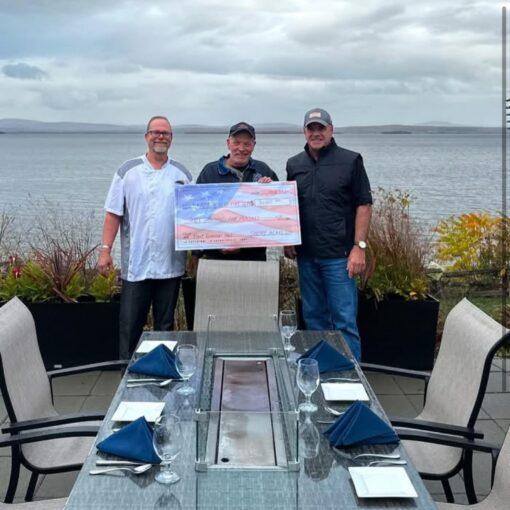 Shore Acres delivers check to North Hero Volunteer Fire Department for your support through our First responders table.