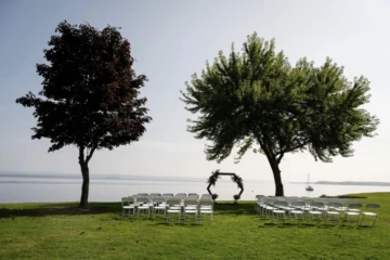 Lake shore set up for a wedding ceremony.